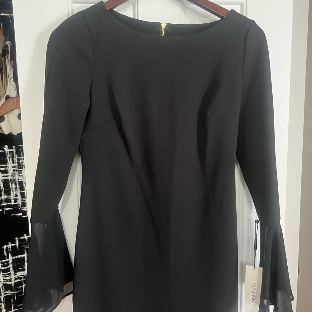 New with tags , Calvin Klein black dress / gold zipper!